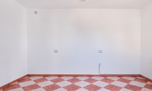 Spacious empty bedroom with tiled floor in detached villa in Turre, Almería.