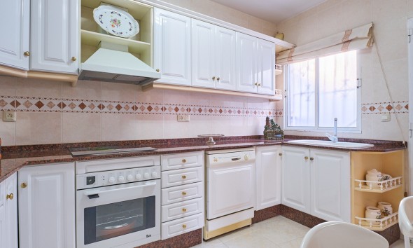  Fully equipped kitchen with all appliances and access to the back garden in a family home in Turre, ready to move into.